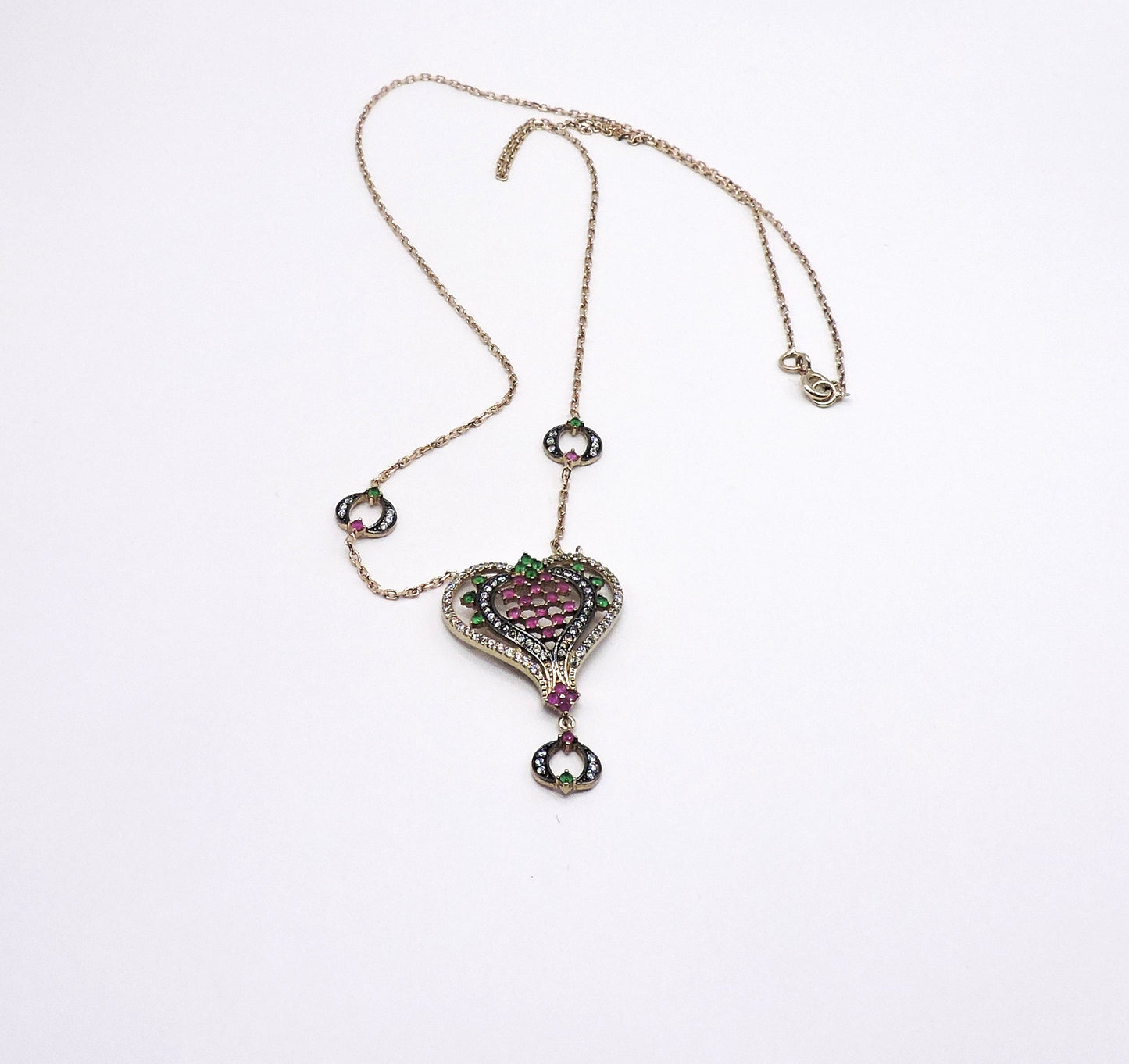Gold-plated silver heart-shaped necklace with semi-precious stones.