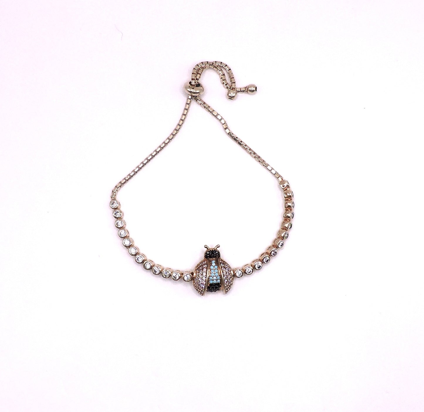 Rose gold silver bracelet with a Lady bag and zircons