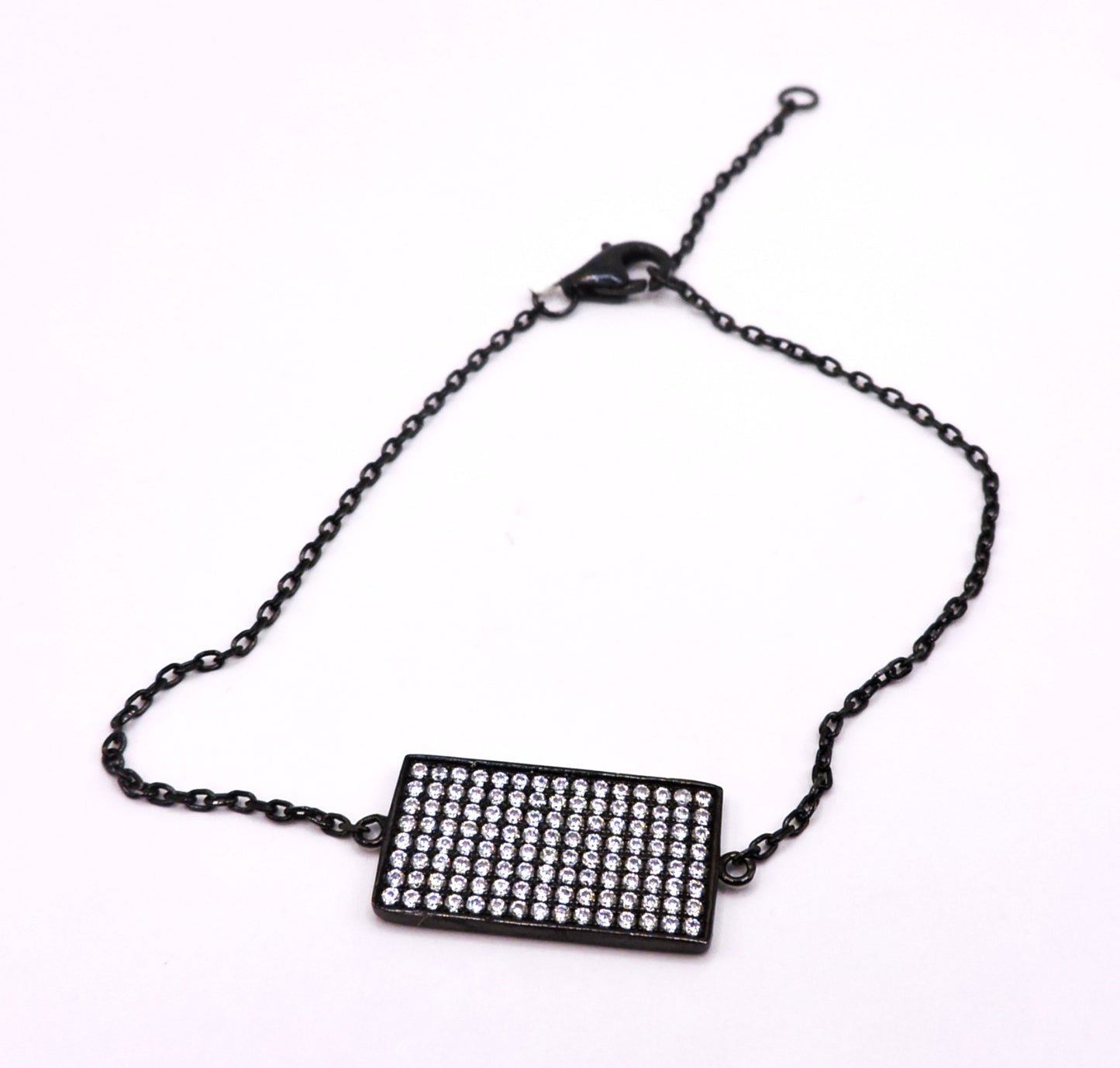 Black square silver bracelet with zircons.