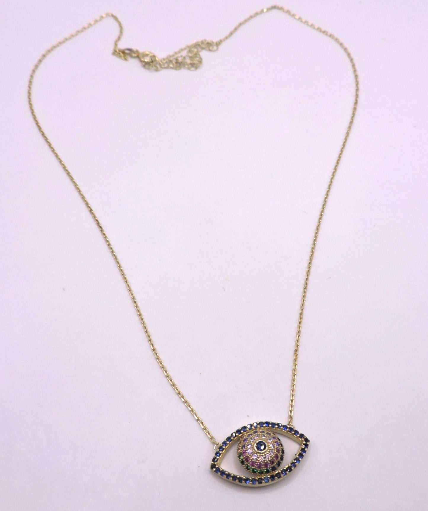 Gold-plated silver eye necklace with colored zircons.