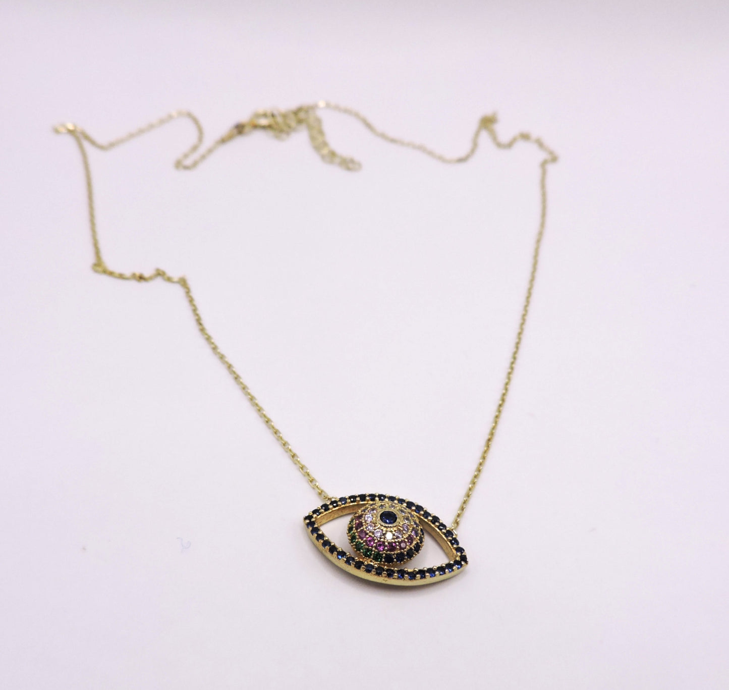 Gold-plated silver eye necklace with colored zircons.