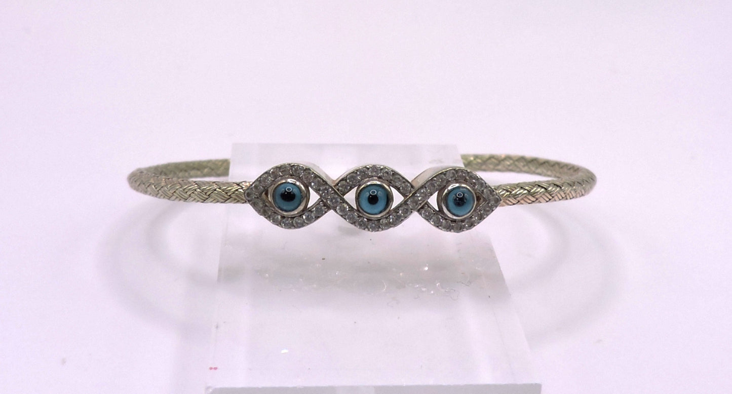 3-eye bracelet in light gold-plated silver with zircons.