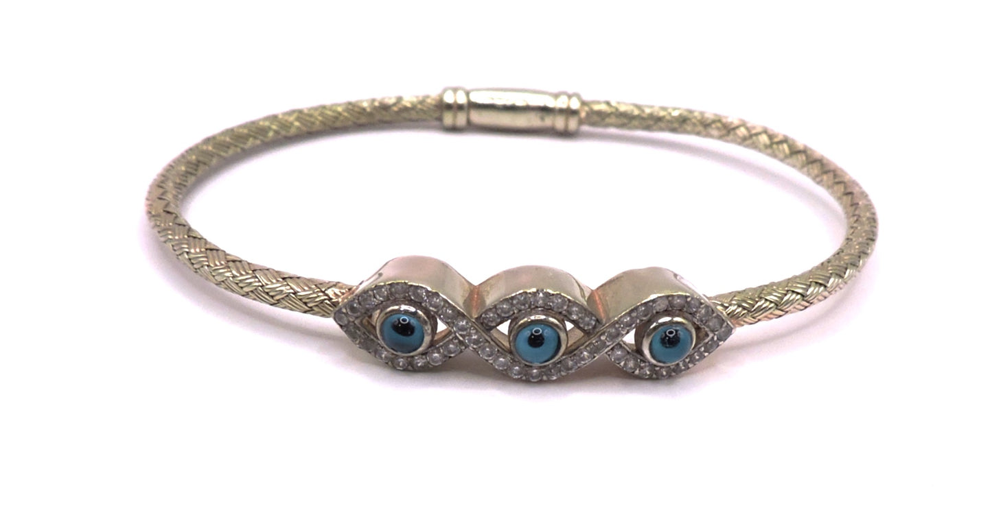 3-eye bracelet in light gold-plated silver with zircons.