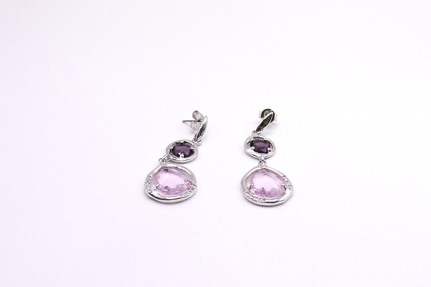 Silver earring with pink semiprecious stone and zircons.