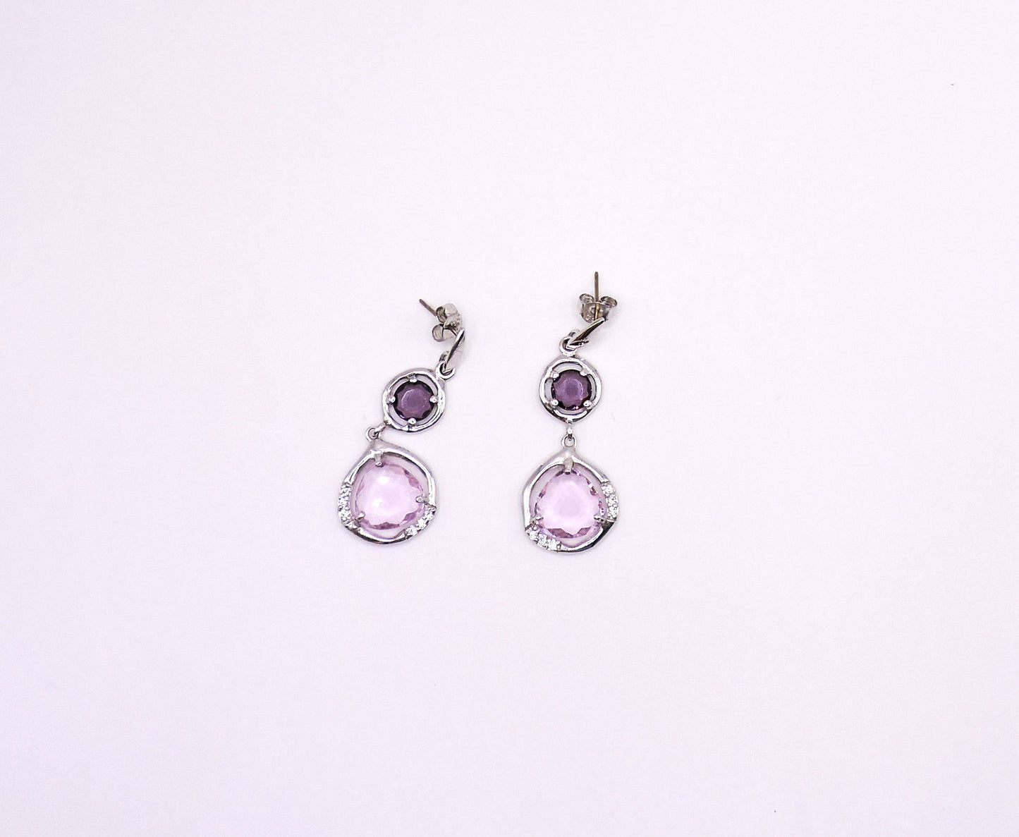 Silver earring with pink semiprecious stone and zircons.