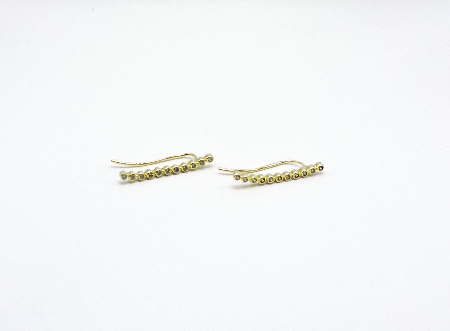 Long silver earring, gold-plated with zircons
