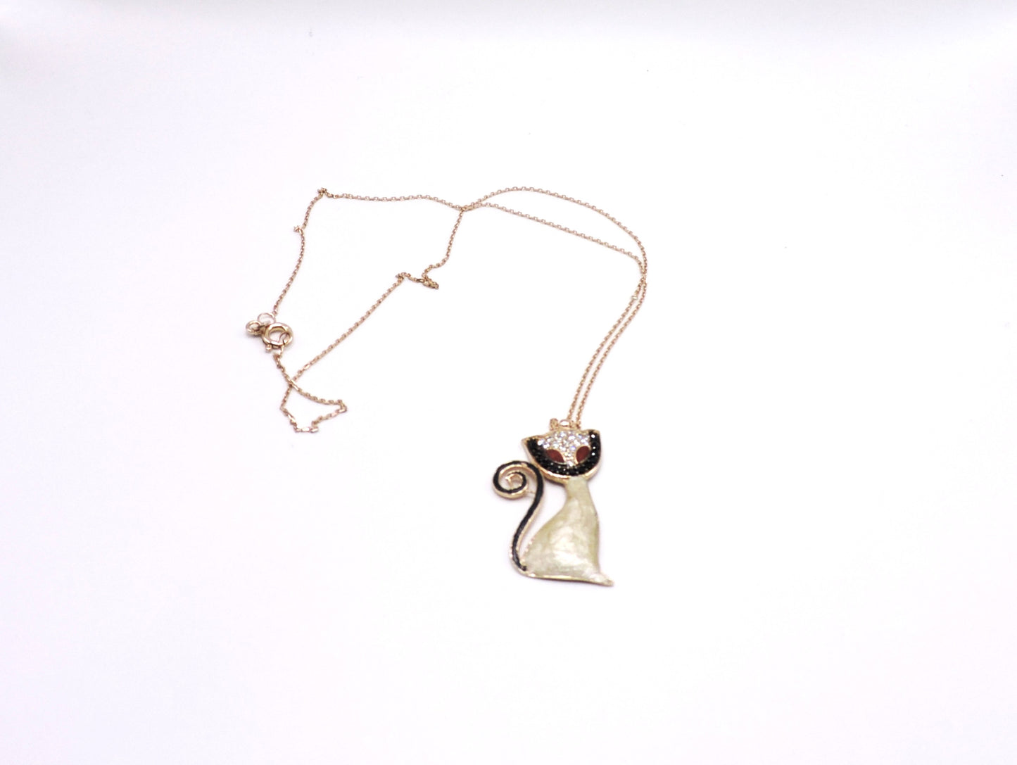 Rose gold-colored silver necklace in the shape of a cat with micropave enamel.