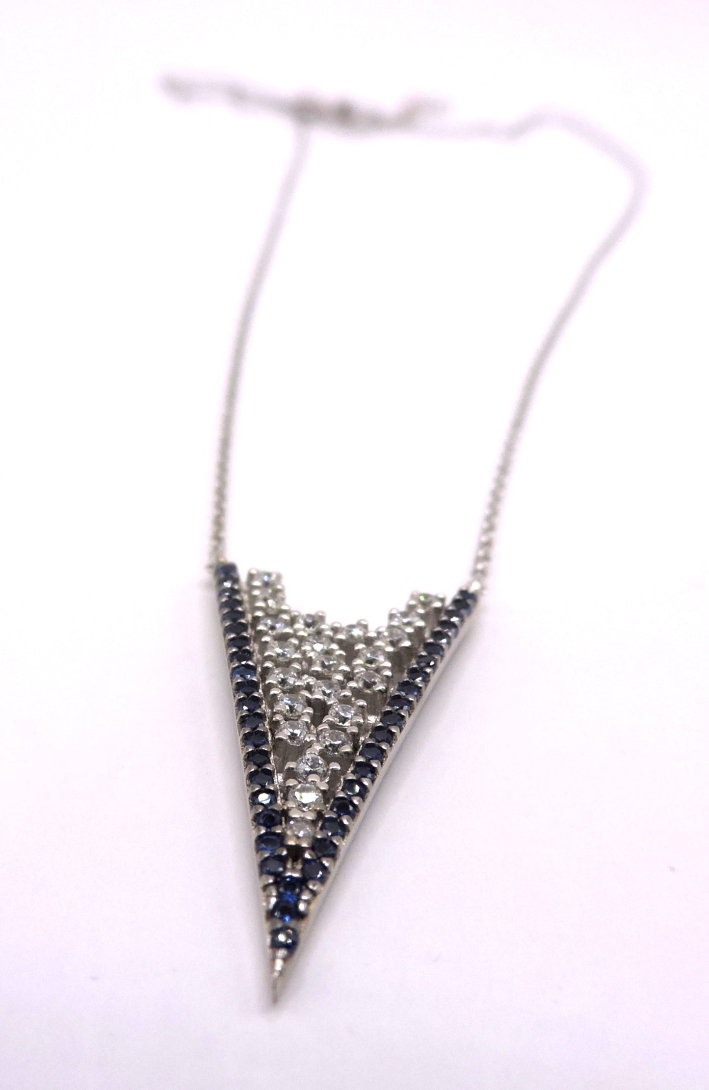 White and blue zircon necklace in silver in the shape of an arrowhead