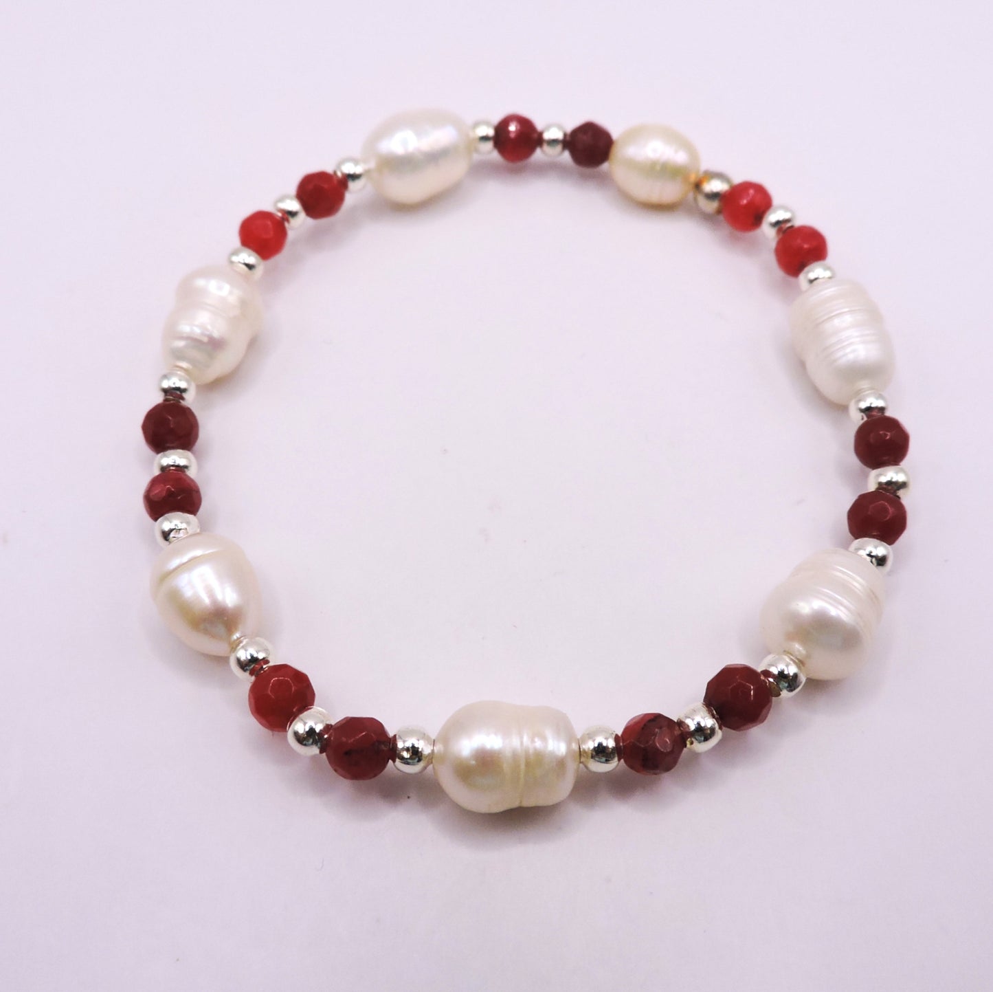 River pearl bracelet with real red stones.