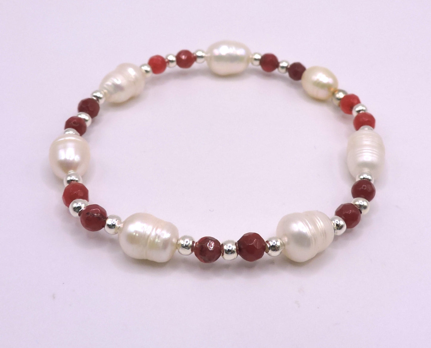 River pearl bracelet with real red stones.
