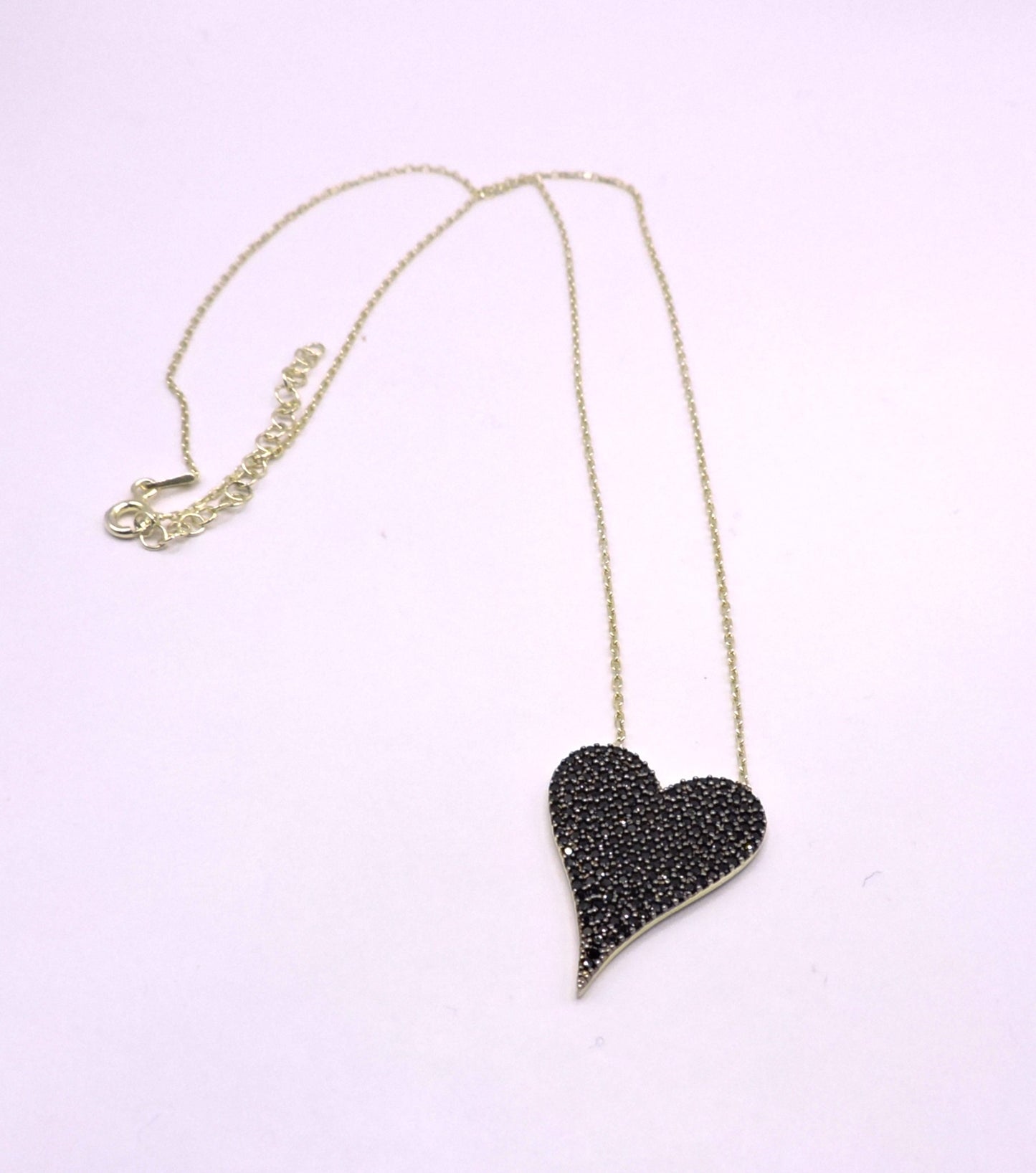 Gold-plated silver necklace, heart-shaped with black zircons.