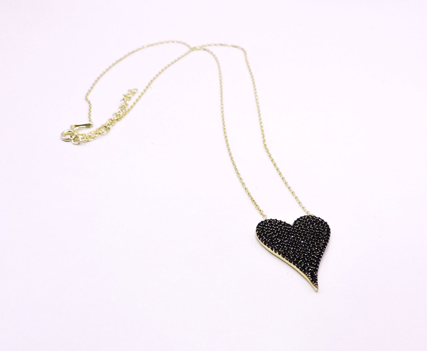 Gold-plated silver necklace, heart-shaped with black zircons.