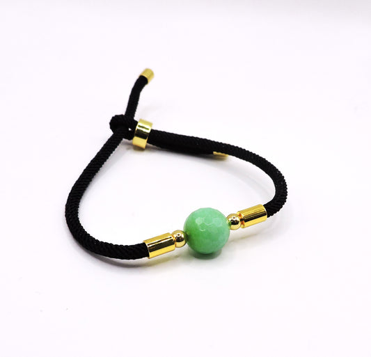 Adjustable cord bracelet with real green stone.
