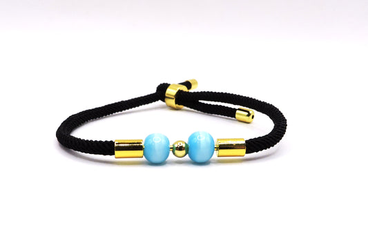 Adjustable cord bracelet with real Turquoise stone.